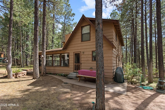 3910 Larson Loop, Forest Lakes, AZ 85931 - rear view of property featuring a patio