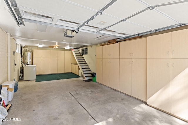 3910 Larson Loop, Forest Lakes, AZ 85931 - garage featuring a garage door opener and washer / clothes dryer