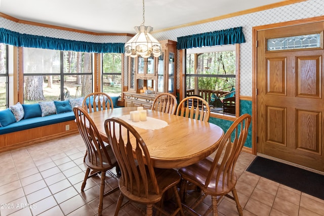 3910 Larson Loop, Forest Lakes, AZ 85931 - dining space featuring wallpapered walls, light tile patterned floors, crown molding, and a chandelier