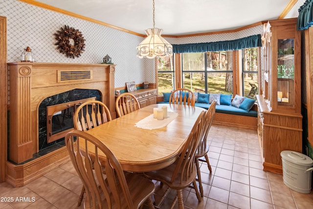 3910 Larson Loop, Forest Lakes, AZ 85931 - dining area with wallpapered walls, a fireplace, crown molding, light tile patterned flooring, and a chandelier