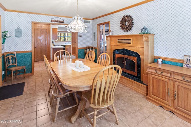 3910 Larson Loop, Forest Lakes, AZ 85931 - dining room with wallpapered walls, crown molding, a fireplace, light tile patterned flooring, and a chandelier