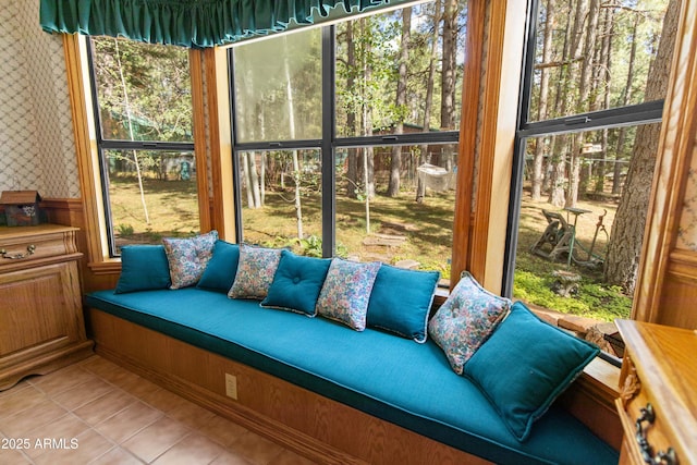 3910 Larson Loop, Forest Lakes, AZ 85931 - sunroom / solarium with wallpapered walls, tile patterned floors, plenty of natural light, and a wainscoted wall