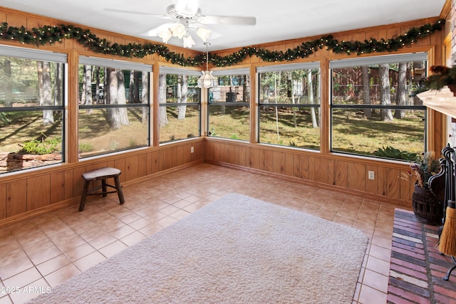 3910 Larson Loop, Forest Lakes, AZ 85931 - unfurnished sunroom featuring tile patterned floors and wood walls