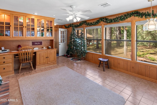 3910 Larson Loop, Forest Lakes, AZ 85931 - office area with built in desk, light tile patterned floors, ceiling fan, and wood walls