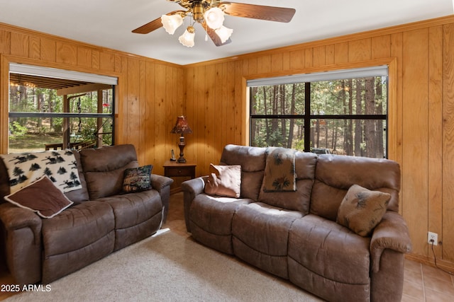 3910 Larson Loop, Forest Lakes, AZ 85931 - living area with wooden walls, ceiling fan, and ornamental molding
