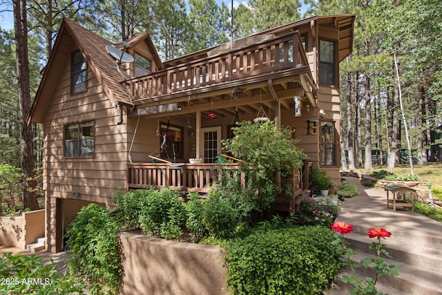 3910 Larson Loop, Forest Lakes, AZ 85931 - back of property featuring a garage and a wooden deck