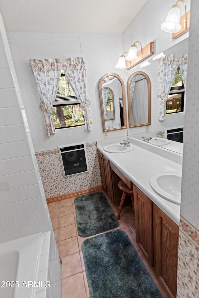 3910 Larson Loop, Forest Lakes, AZ 85931 - bathroom featuring wallpapered walls, healthy amount of natural light, a bath, double vanity, and tile patterned floors