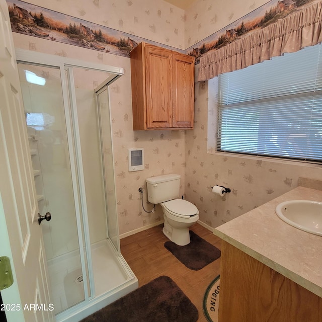 3910 Larson Loop, Forest Lakes, AZ 85931 - full bath with wallpapered walls, a shower stall, vanity, and wood finished floors