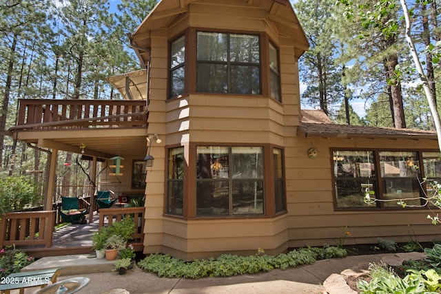 3910 Larson Loop, Forest Lakes, AZ 85931 - view of property exterior with a wooden deck