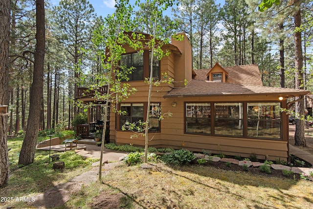 3910 Larson Loop, Forest Lakes, AZ 85931 - back of house featuring roof with shingles