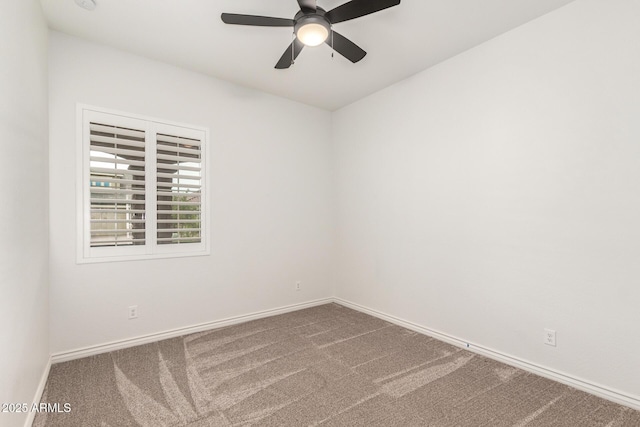 unfurnished room with carpet flooring, baseboards, and a ceiling fan