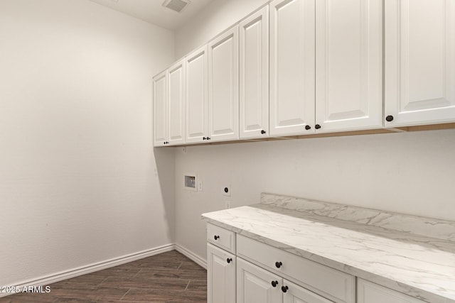 laundry room featuring cabinet space, washer hookup, baseboards, electric dryer hookup, and dark wood finished floors