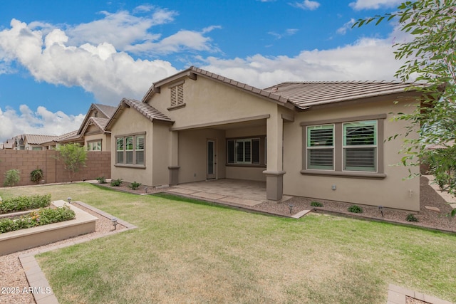 back of house with stucco siding, a patio, and a tiled roof