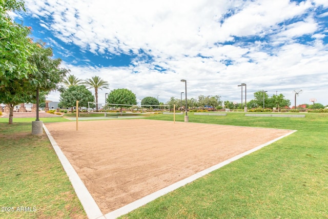 surrounding community with volleyball court and a yard