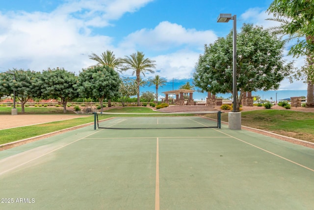 view of tennis court with fence