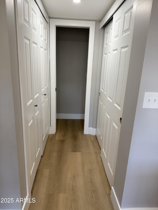170 E Guadalupe Rd Unit 173, Gilbert, AZ 85234 - hallway featuring light wood-type flooring and baseboards