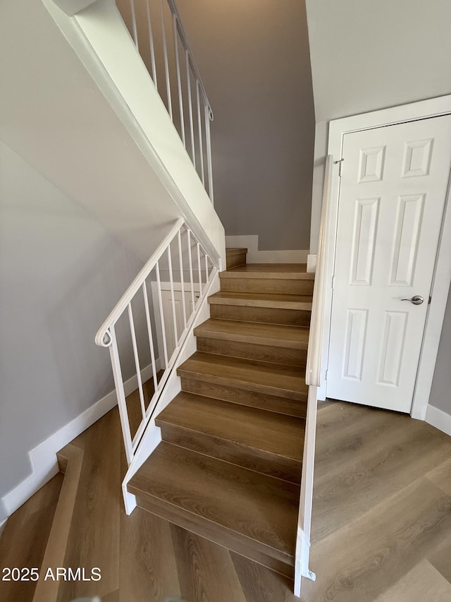 170 E Guadalupe Rd Unit 173, Gilbert, AZ 85234 - staircase featuring wood finished floors and baseboards