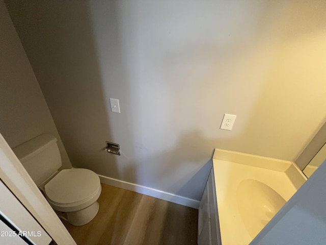 170 E Guadalupe Rd Unit 173, Gilbert, AZ 85234 - bathroom with baseboards, wood finished floors, vanity, and toilet