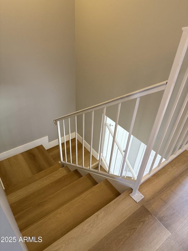 170 E Guadalupe Rd Unit 173, Gilbert, AZ 85234 - staircase with wood finished floors and baseboards