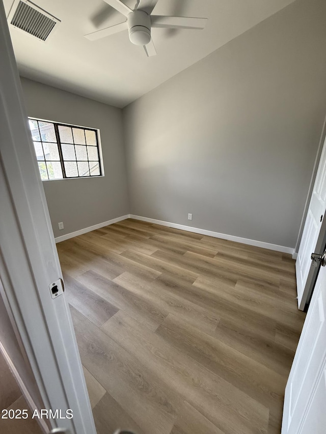 170 E Guadalupe Rd Unit 173, Gilbert, AZ 85234 - spare room with ceiling fan, light wood finished floors, and baseboards