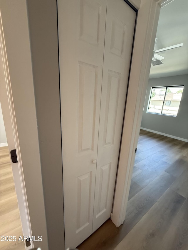 170 E Guadalupe Rd Unit 173, Gilbert, AZ 85234 - detailed view of wood finished floors, baseboards, and ceiling fan