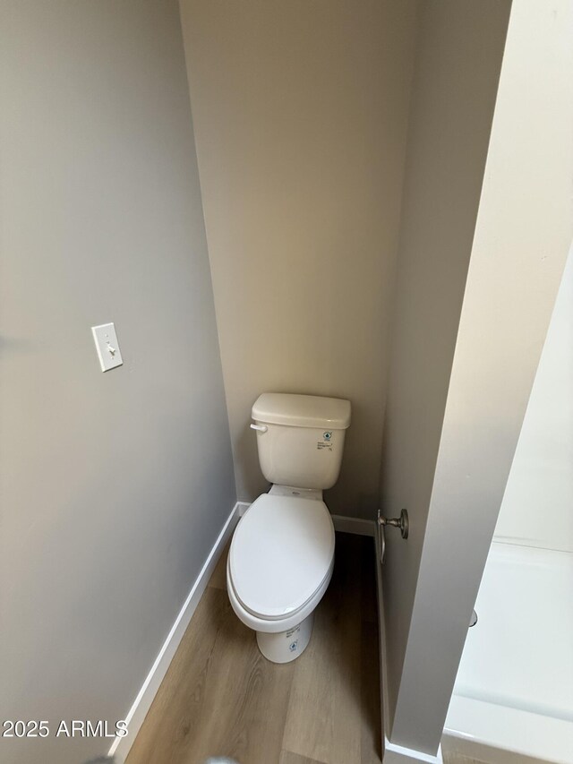 170 E Guadalupe Rd Unit 173, Gilbert, AZ 85234 - bathroom with baseboards, wood finished floors, and toilet