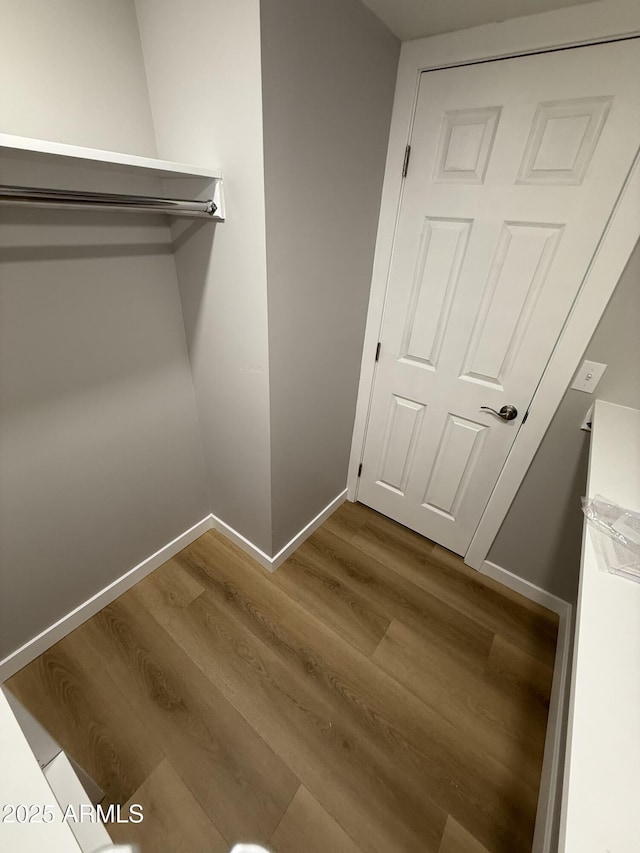 170 E Guadalupe Rd Unit 173, Gilbert, AZ 85234 - walk in closet with dark wood-type flooring