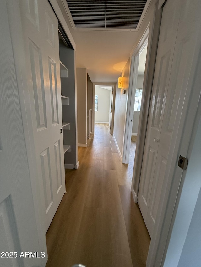 170 E Guadalupe Rd Unit 173, Gilbert, AZ 85234 - hallway with light wood-style floors and baseboards