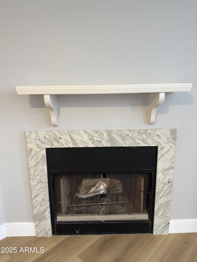 170 E Guadalupe Rd Unit 173, Gilbert, AZ 85234 - detailed view of a high end fireplace, wood finished floors, and baseboards