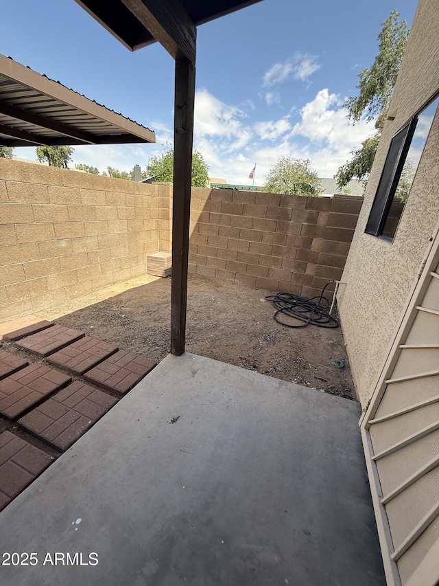 170 E Guadalupe Rd Unit 173, Gilbert, AZ 85234 - fenced backyard with a patio area