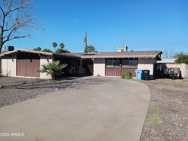 ranch-style house with a carport