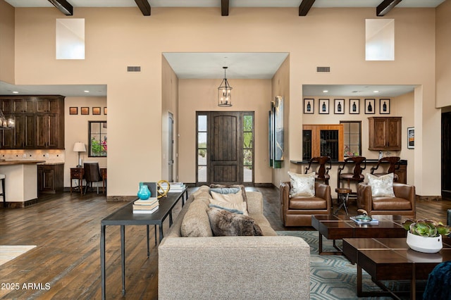 8454 E Leaning Rock Rd, Scottsdale, AZ 85266 - living room with visible vents, baseboards, and dark wood-style floors