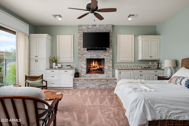 8454 E Leaning Rock Rd, Scottsdale, AZ 85266 - bedroom featuring access to outside, light carpet, a fireplace, and visible vents
