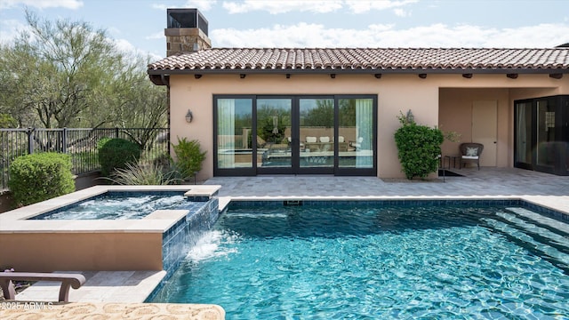 8454 E Leaning Rock Rd, Scottsdale, AZ 85266 - back of property featuring a fenced in pool, a chimney, an in ground hot tub, a tiled roof, and fence