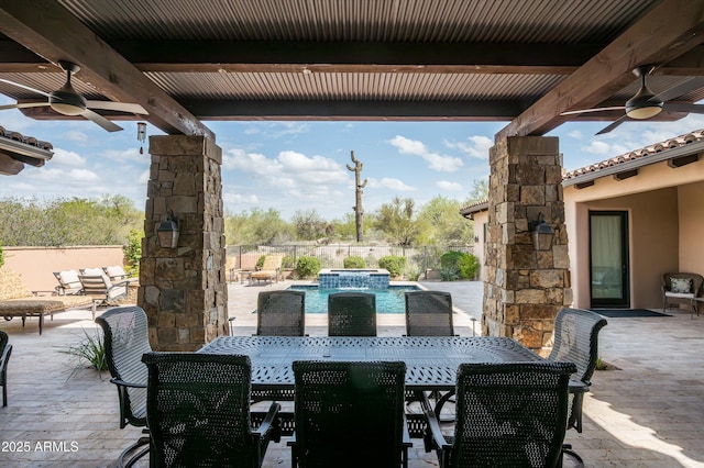 8454 E Leaning Rock Rd, Scottsdale, AZ 85266 - view of patio with outdoor dining space, a pool with connected hot tub, fence, and a ceiling fan