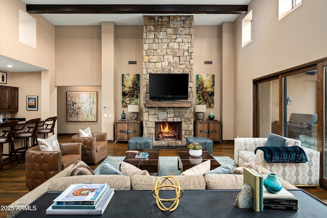 8454 E Leaning Rock Rd, Scottsdale, AZ 85266 - living room featuring beam ceiling, a towering ceiling, wood finished floors, and a fireplace