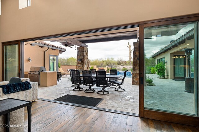 8454 E Leaning Rock Rd, Scottsdale, AZ 85266 - doorway to outside with hardwood / wood-style flooring and ceiling fan