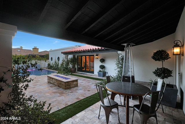 2421 E Montebello Ave, Phoenix, AZ 85016 - view of patio featuring an outdoor fire pit, outdoor dining area, and french doors