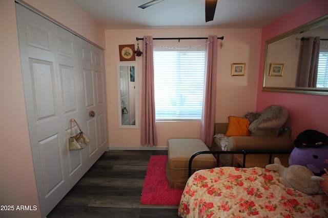 bedroom with dark hardwood / wood-style floors and ceiling fan