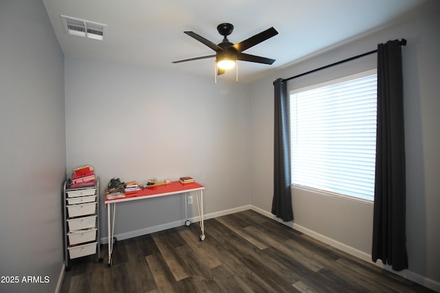 interior space with dark hardwood / wood-style floors and ceiling fan