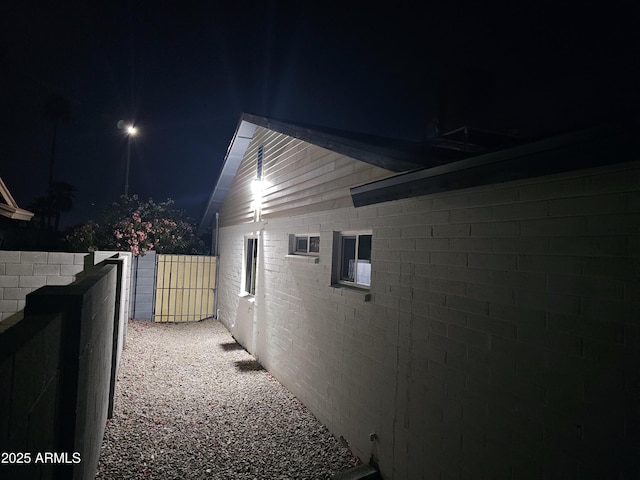 property exterior at night with fence
