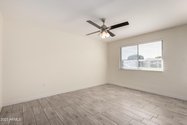 spare room featuring ceiling fan and light hardwood / wood-style flooring