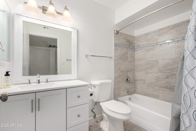 full bathroom featuring toilet, shower / tub combo with curtain, and vanity