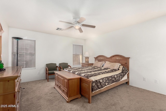 bedroom with light carpet and ceiling fan