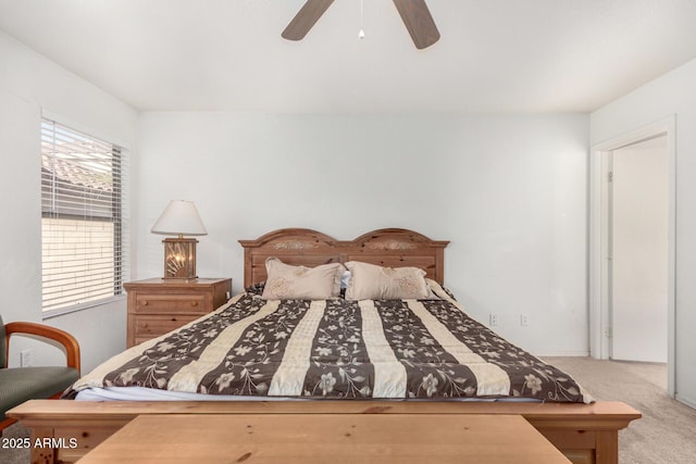 bedroom featuring ceiling fan and light carpet