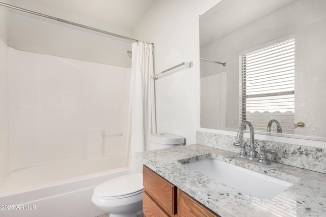 full bathroom featuring vanity, toilet, and shower / tub combo