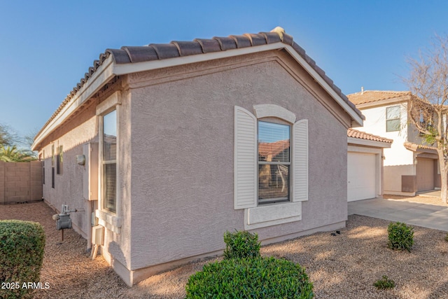 view of side of property featuring a garage