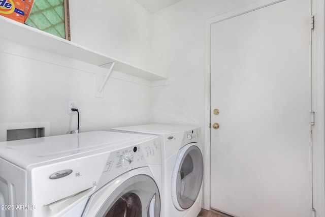 clothes washing area featuring washing machine and dryer