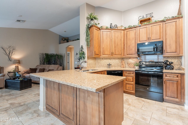 490 W Encinas St, Gilbert, AZ 85233 - kitchen featuring black appliances, arched walkways, a peninsula, a sink, and lofted ceiling