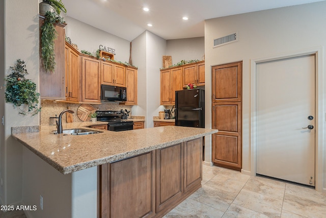 490 W Encinas St, Gilbert, AZ 85233 - kitchen with black appliances, a sink, light stone countertops, a peninsula, and brown cabinetry